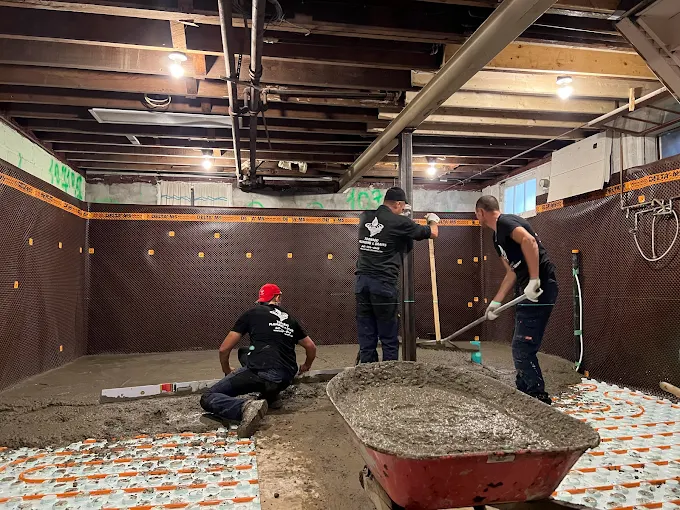Foundation waterproofing comparison — interior membrane vs exterior excavation on a Toronto basement wall, Tornado Plumbing & Drains.