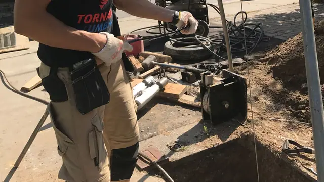 Serhiy Marunchuk working on an outdoor Tornado Plumbing & Drains job site